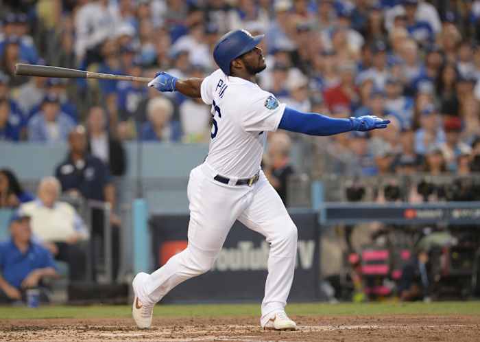 Oct 28, 2018; Los Angeles, CA, USA; Los Angeles Dodgers outfielder Yasiel Puig (66) hits a single in the second inning against the Boston Red Sox in game five of the 2018 World Series at Dodger Stadium.